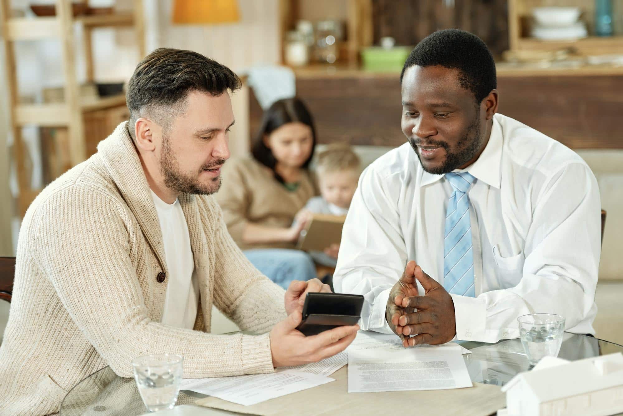 Ethnic Man Consulting Client On Home Loan